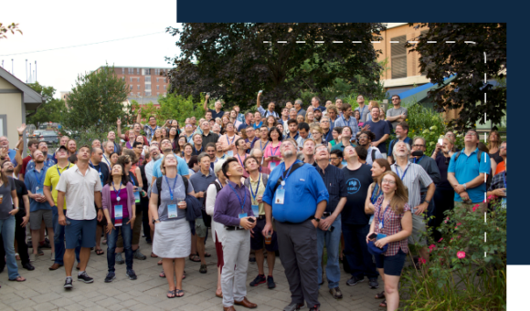 big group shot of people looking up