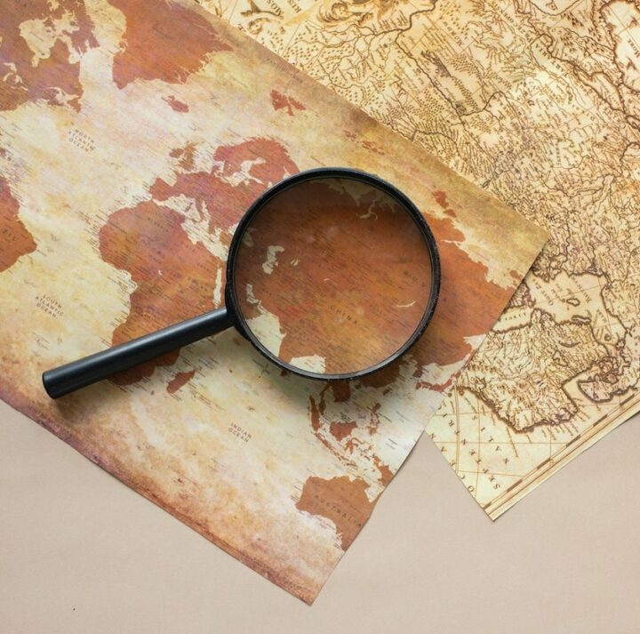 magnifying glass over maps