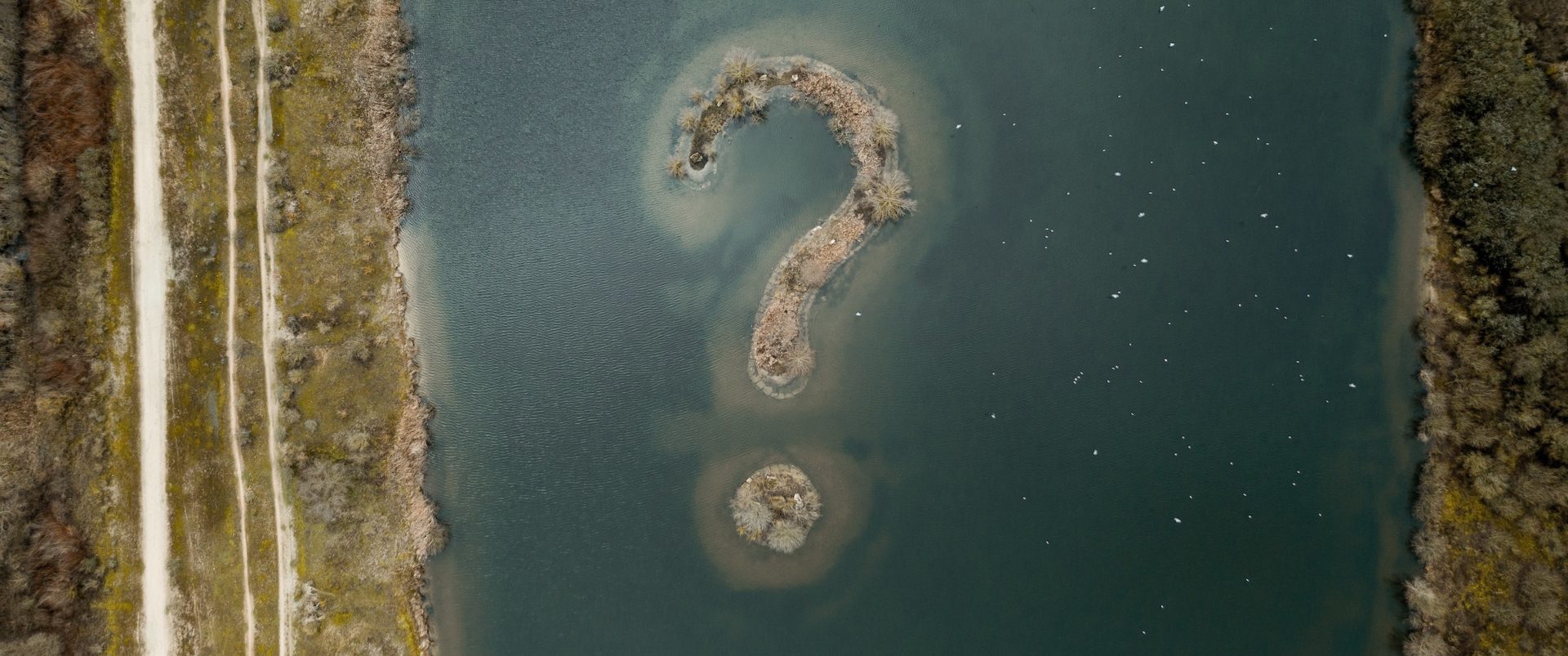 overview of a body of water with a question mark formation