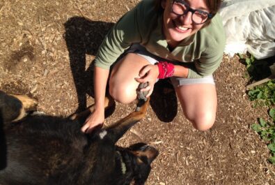 girl petting a dog