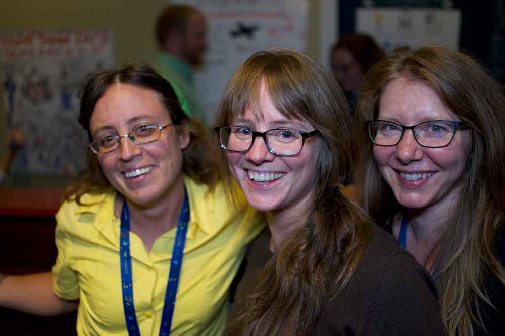 three women smiling for the camera