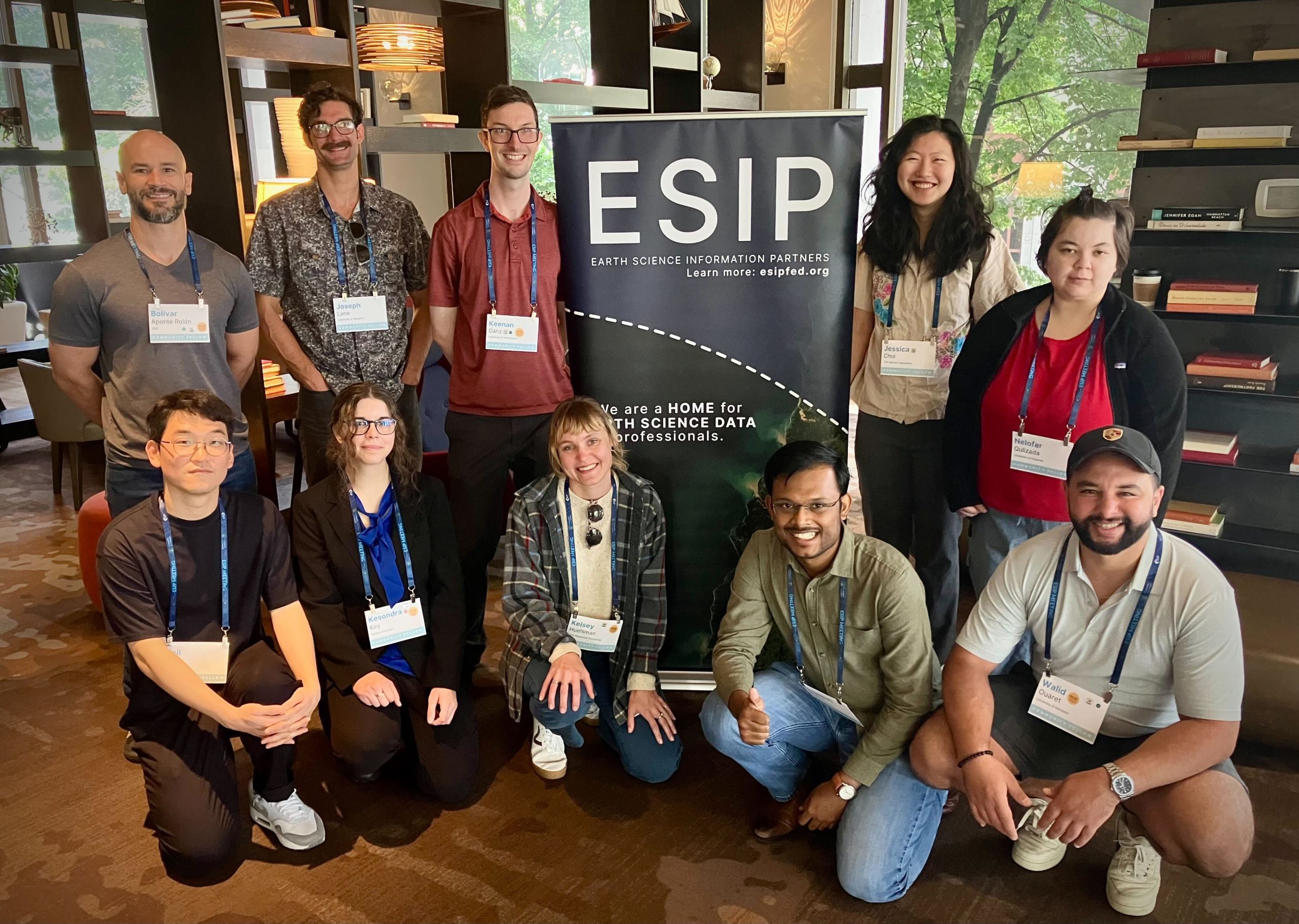 Community Fellows posing witha sign at the July ESIP Meeting.